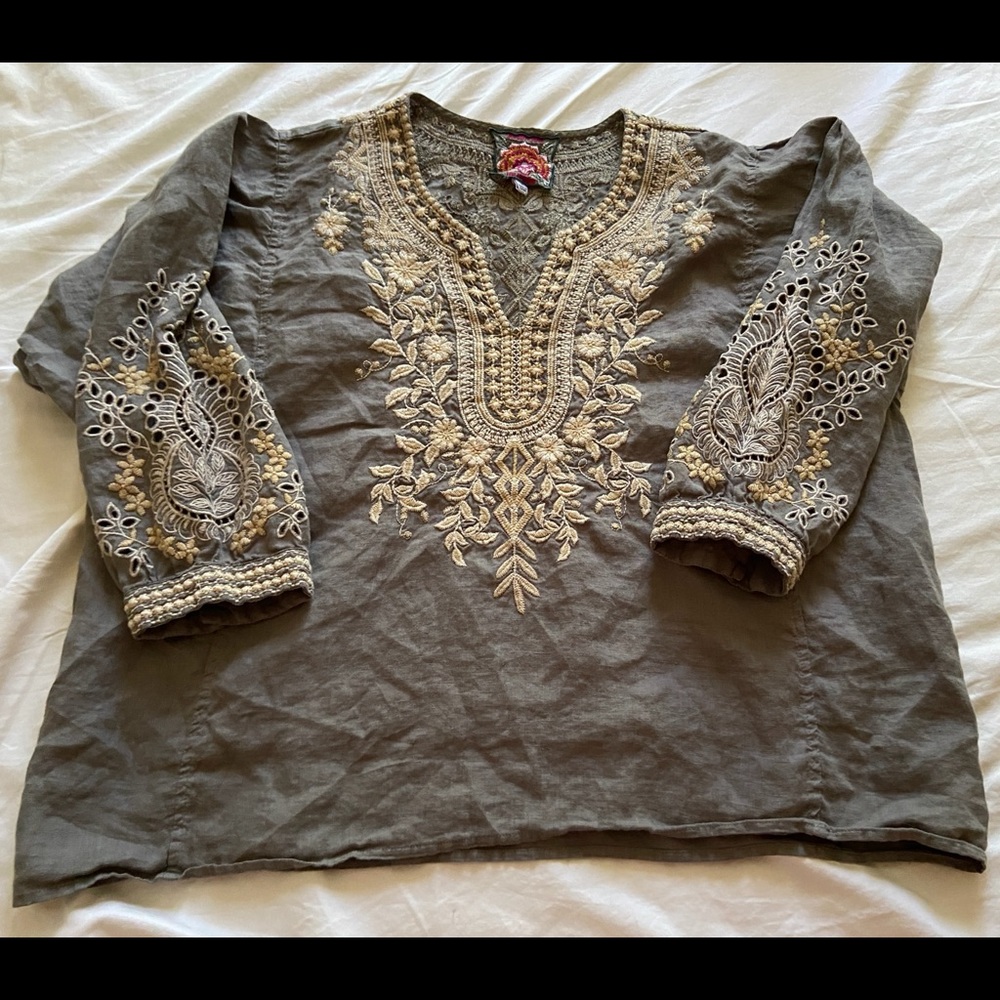 Airy linen top with stunning embroidery. Worn only twice. Perfect condition.
